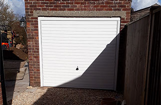 A Garador steel range up and over garage door and frame in the Horizon style. Fitted in Basingstoke. Hampshire.