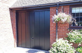 A Garador Windsor style up and over garage door in Black. Fitted in Sandhurst, Berkshire.