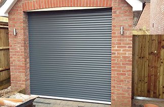 A Gliderol Anthracite compact insulated roller shutter garage door fitted in Alton, Hampshire.