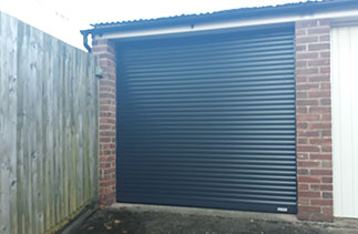 A Gliderol 55 compact insulated roller shutter garage door fitted in Yatley, Hampshire.