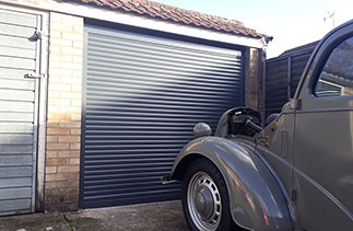 A Gliderol 55 Anthracite compact insulated roller shutter garage door fitted in Yatley, Hampshire.