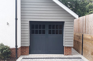 One of Two GRP up and over garage door with a steel frame. Fitted in Windlesham, Surrey.