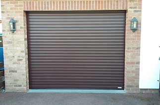 A Gliderol Mahogany insulated roller shutter garage door fitted in Iver Heath, Berkshire
