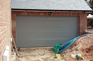 A Seceuroglide Excel Roller shutter garage door finished in Ral 7042. Fitted to plot 1 in Alton, Hampshire.