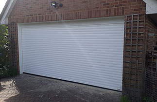 A Sws Seceuroglide Excel Roller Shutter garage door fitted in West End, Surrey.