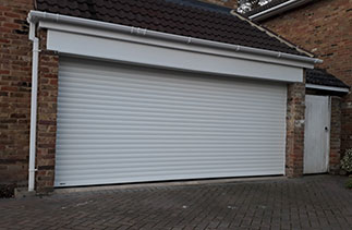 A Sws Seceuroglide Excel in White with a White UPVC fascia. Fitted in Camberley, Surrey.