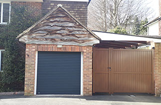 A Sws Seceuroglide Excel insulated roller shutter garage door in Anthracite grey with White guides. Fitted in Camberley, Surrey.