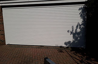 A Sws Seceuroglide Excel insulated Roller Shutter Garage Door white fitted in Camberley, Surrey