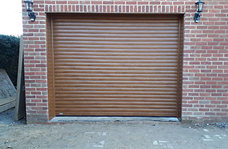 A Sws Seceuroglide Excel roller shutter garage door in Golden Oak. Fitted in Basingstoke, Hampshire.