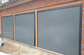Three bespoke Woodrite Accoya timber up and over Garage Doors. Fitted in Jordans, Buckinghamshire.