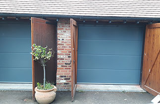 Two Carteck 40mm insulated Solid rib style sectional garage doors. Fitted in Windlesham, Surrey
