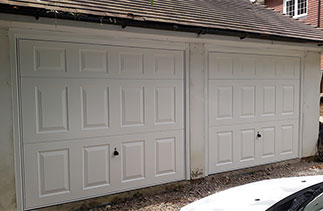 Two Garador Beaumont style White up and over garage doors with White steel frames. Fitted in Sunningdale, Berkshire.