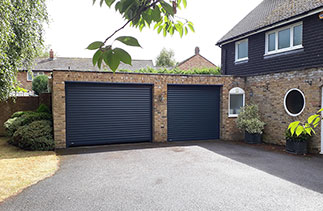 Two Sws Seceuroglide Excel roller shutter garage doors in Anthracite Grey. Fitted in Hurley, Berkshire.