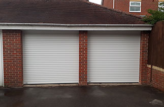 Two Sws Seceuroglide Excel roller shutter garage doors in White. Fitted in Liphook, Surrey.