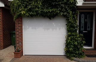 A White Gliderol 55mm Compact roller shutter garage door. Fitted in Westend, Surrey.