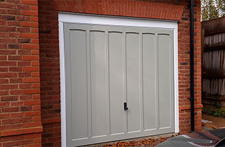 A Woodriet timber up and over garage door with a White chassis and a white steel frame. Fitted in Basingstoke, Hampshire.